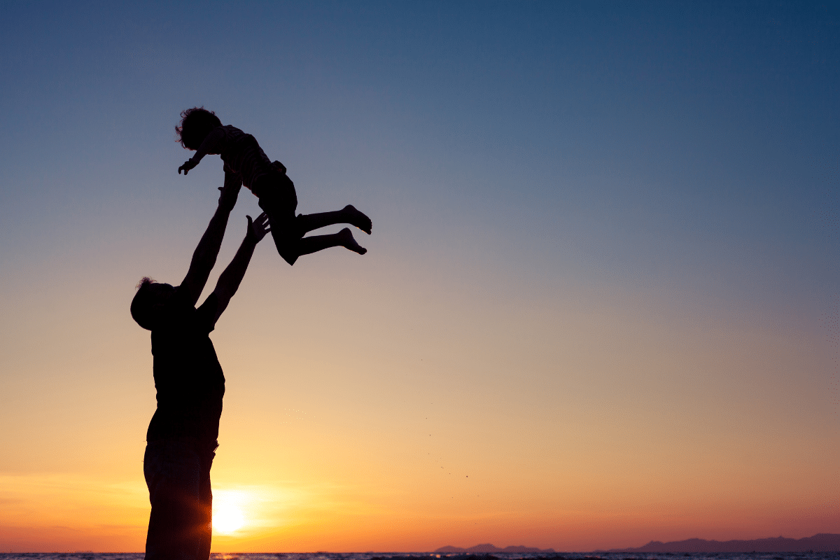 Father holding son